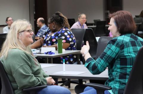 Teachers talking about professional development.